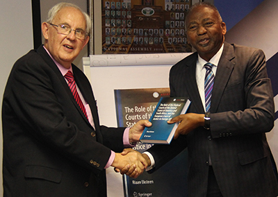 The author, Dr Riaan Eksteen, presenting a copy of his book to the Hon. Dr Peter Katjavivi, Speaker of Namibia’s National Assembly, during the presentation of the book in Windhoek, Namibia, on 9 August 2019