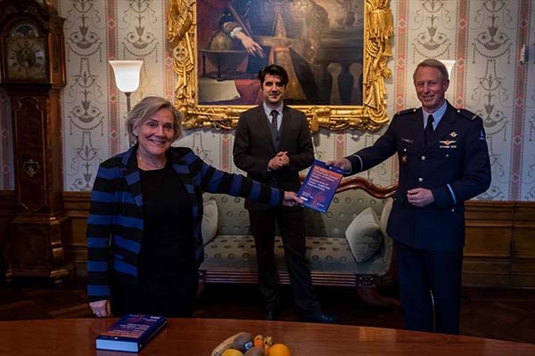 Prof Dr Frans Osinga (seen on the right) presenting a copy of NL ARMS 2020 to Ank Bijleveld, Netherlands Minister of Defence (seen on the left), on behalf of the Netherlands Defence Academy during the presentation of the book on 28 January 2021